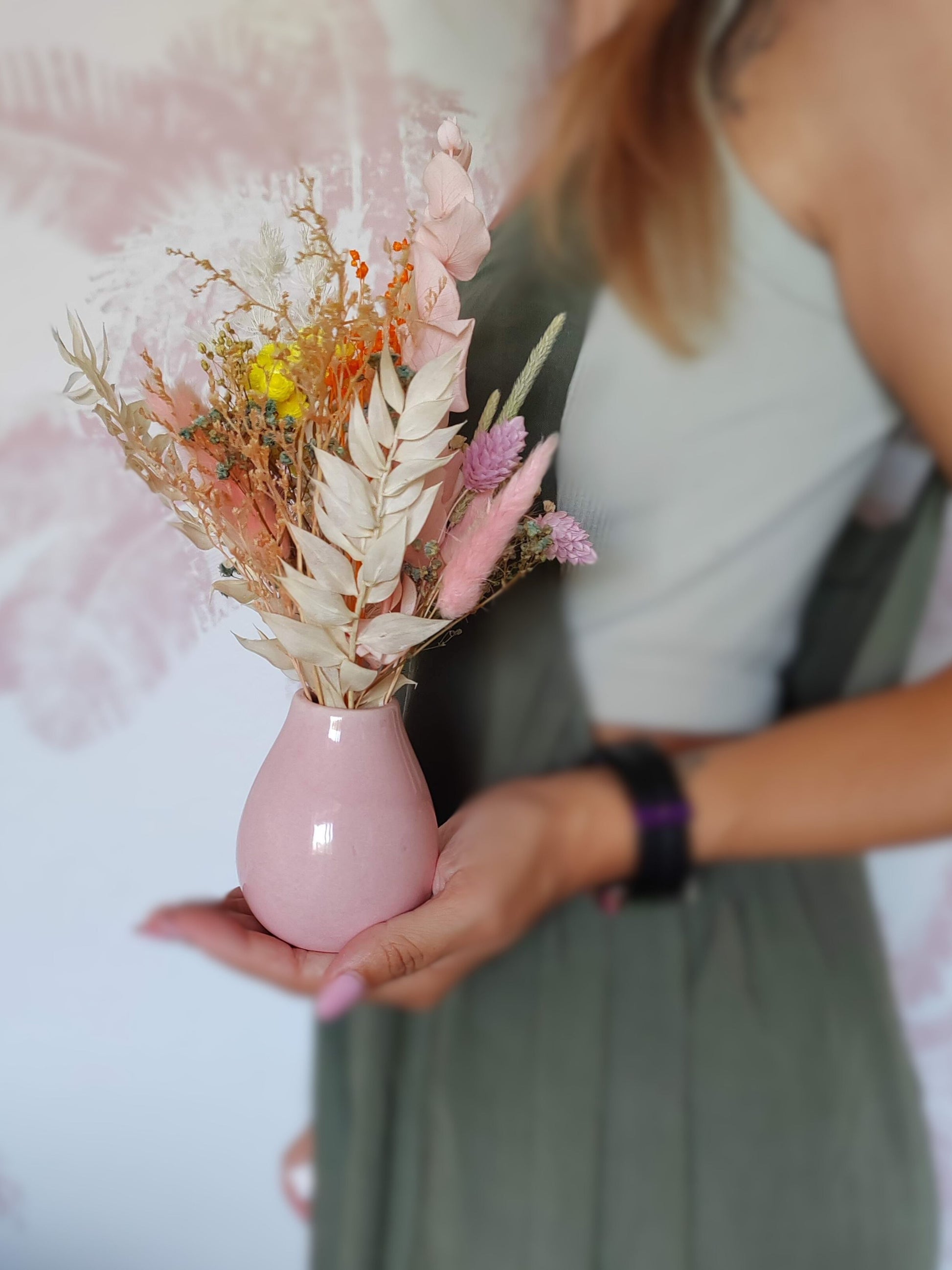 Cute vase with dried and preserved flowers