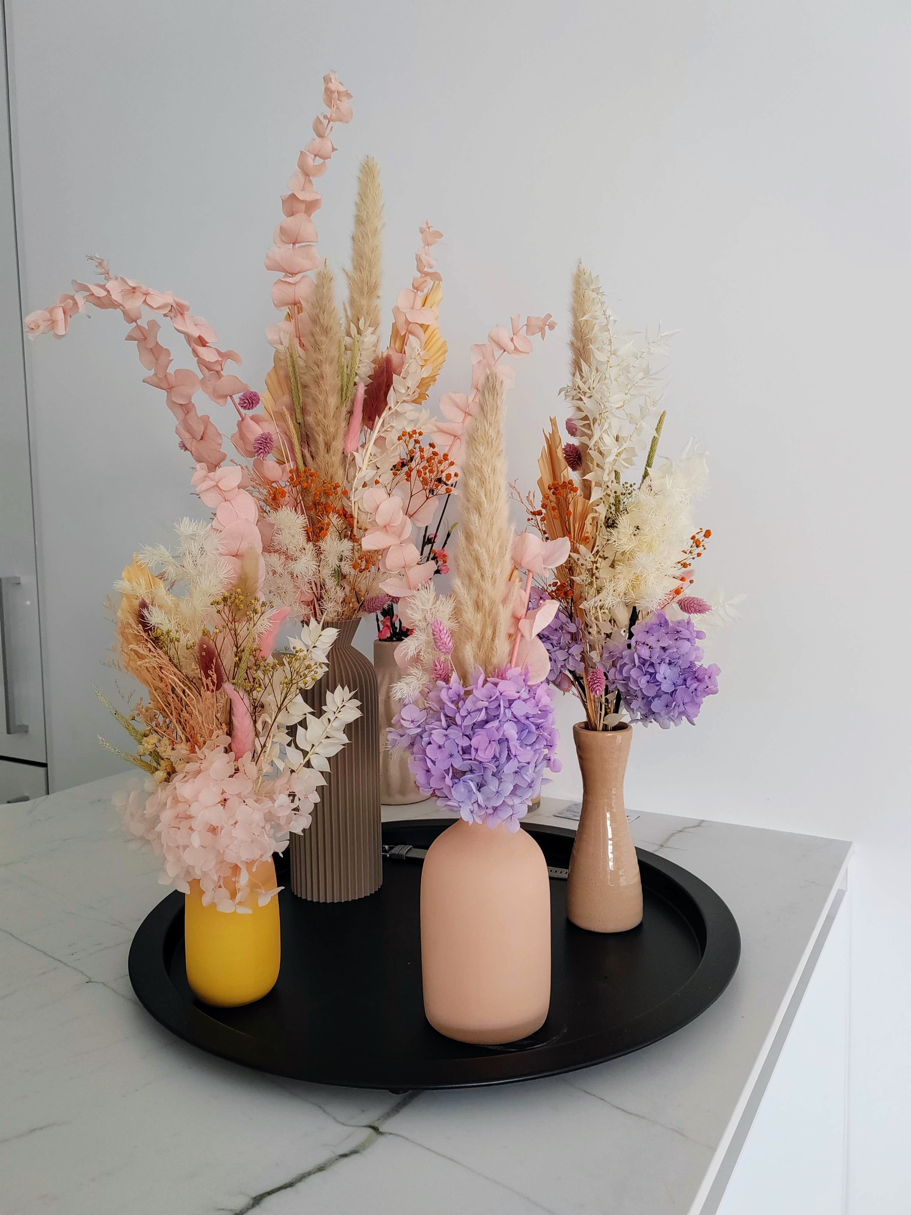 Pastel coloured vases dried and preserved flowers